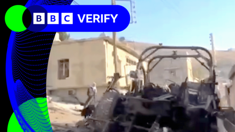 A burnt out jeep in the Syrian village of Beit Jinn