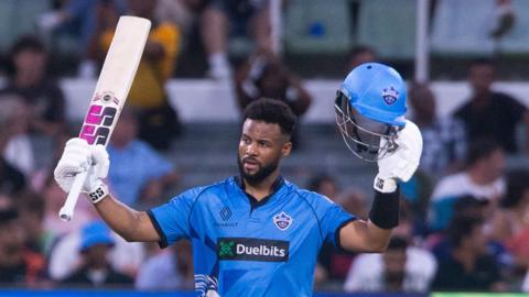 Shai Hope celebrates hitting a century