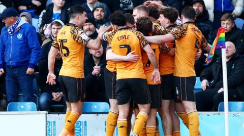 Hull players celebrate at Portsmouth