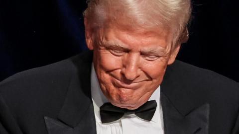 Donald Trump smiles during a charity event