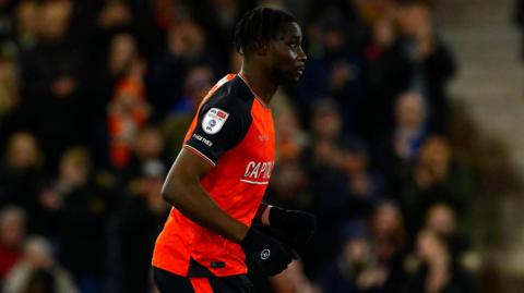 Elijah Adebayo playing for Luton Town against Exeter