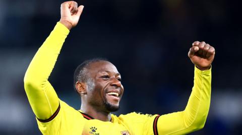 Edo Kayembe celebrates Watford's win at Derby