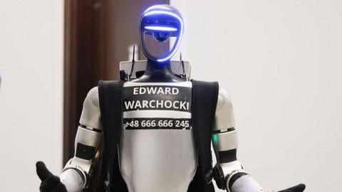 a robot with the name Edward Warchocki printed on the front.