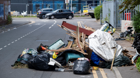 Fly-tipped waste in a street in Birmingham
