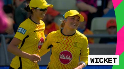 Bess Heath and Emma Jones both smile after Heath's incredible catch