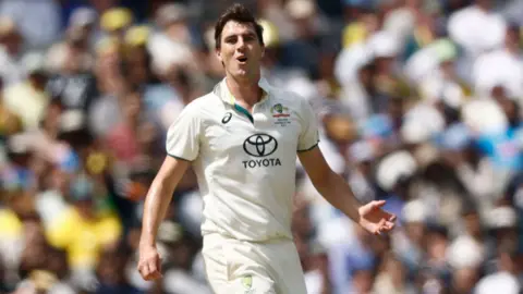 Australia test cricket captain Pat Cummins reacts after bowling a delivery