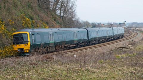A Great Western Railway Class 165 Diesel Multiple Unit passenger train, with its distinctive green livery