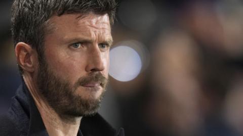 Michael Carrick looks on