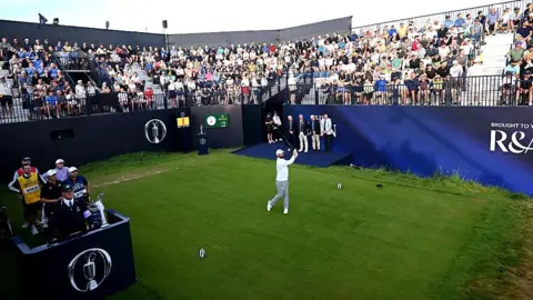Matthew Baldwin hits first tee shot
