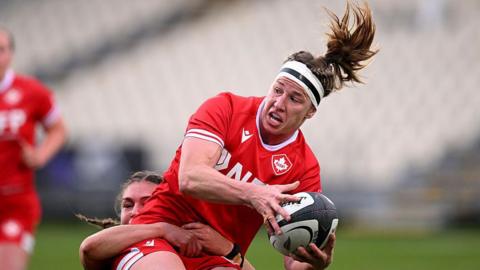 Laetitia Royer charges forward while playing for Canada