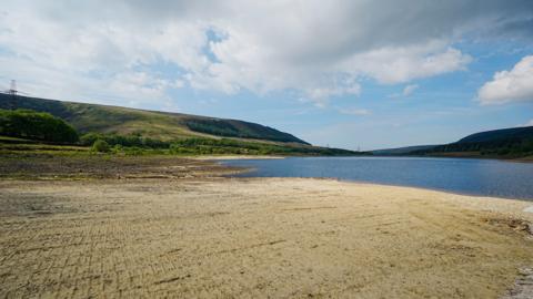 part-full reservoir with expanse of land where water should be