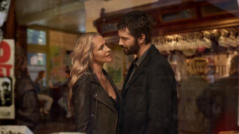 A man and woman looking in each others eyes
