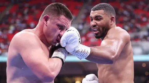 Solomon Dacres punches Vladyslav Sirenko in the face