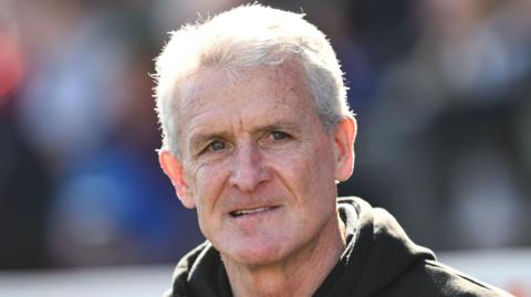 Mark Hughes looks on during Carlisle United's League Two fixture against Newport County
