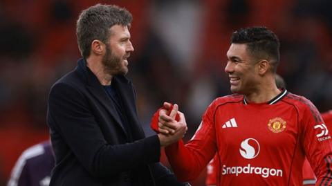 Michael Carrick and Casemiro clasp hands after Manchester United's win