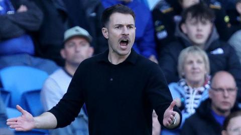 Aaron Ramsey in the dugout at Cardiff City