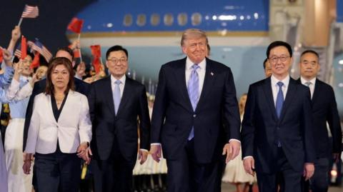 U.S. President Donald Trump participates in an arrival ceremony at Beijing Capital International Airport