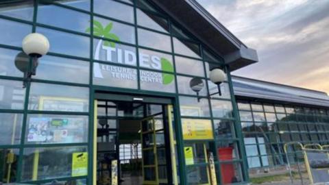 An exterior shot of the glass frontage of Tides Leisure Centre in Deal