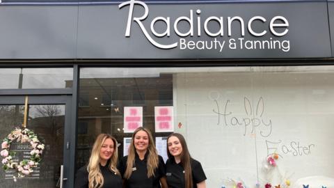 Chloe and two members of her team outside Radiance Beauty and Tanning