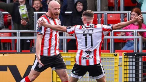 Liam Boyce and Gavin Whyte celebrating one of Liam Boyce's goals