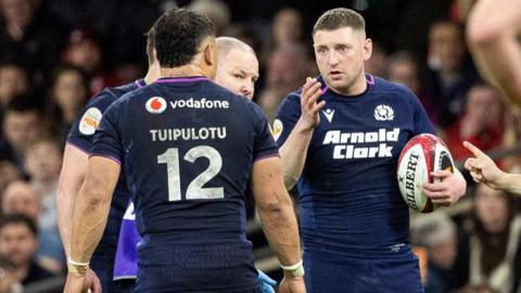 Scotland's Finn Russell and Sione Tuipulotu during a Guinness Six Nations match between Wales and Scotland at The Principality Stadium, on February 21, 2026, in Cardiff, Wales. 