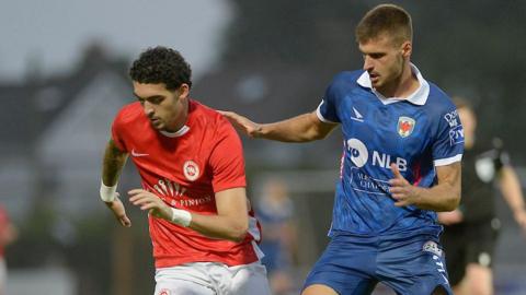 Larne's Kobe Moore in action against Leonat Vitija of Prishtina