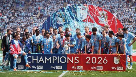 Coventry City players celebrate with the Championship trophy