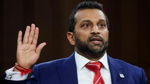 Patel holding up right hand
