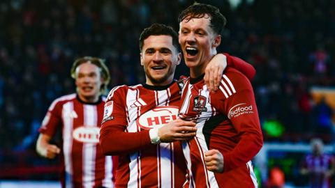 Ethan Brierley celebrates scoring for Exeter