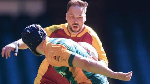 Iwan Roberts of Caernarfon takes on Michael Powell of Bridgend Athletic in the 2025 WRU Men’s Division 1 Cup final 