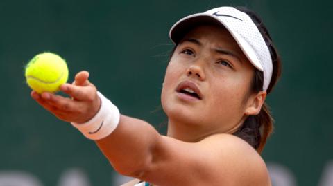 Emma Raducanu of Great Britain in action against Xinyu Wang of China at French Open. 