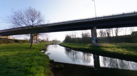 The Obridge Viaduct bridge as seen from below, with water running underneath it 