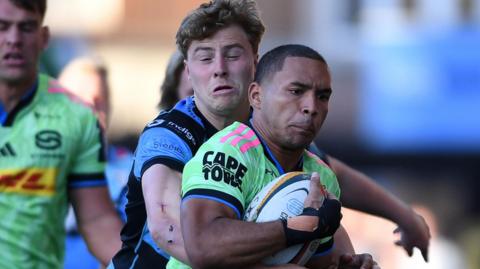 Cardiff wing Jacob Beetham tackles Suleiman Hartzenberg