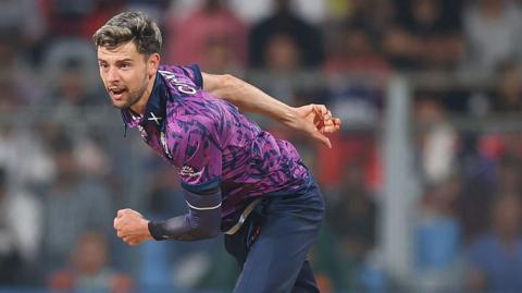 Brad Currie of Scotland in bowling action during the ICC Men's T20 World Cup India & Sri Lanka 2026 match between Scotland and Nepal at Wankhede Stadium on February 17, 2026 in Mumbai, India
