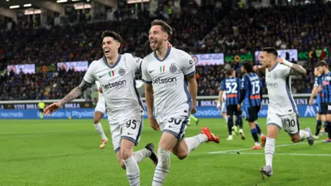 Carlos Augusto celebrates scoring for Inter Milan