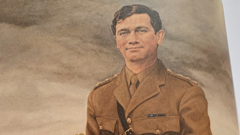 An oil painting of Capt Nairac in his brown British Army uniform