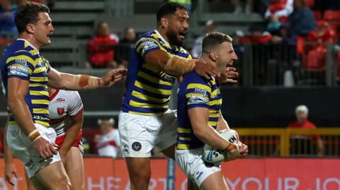 George Williams (right) celebrates scoring for Warrington against Hull KR
