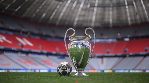 Champions League trophy inside a stadium