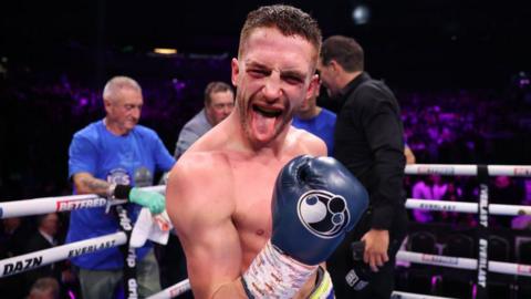 Reece Bellotti raises his glove and sticks out his tongue after beating Michael Gomez Jr in Manchester