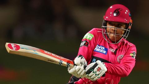 Sophia Dunkley plays a shot