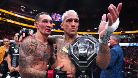 Charles Oliveira and Max Holloway after UFC 326