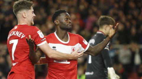 Middlesbrough striker Emmanuel Latte Lath gestures to the crowd with his arms out wide with Hayden Hackney after scoring against Sheffield United.