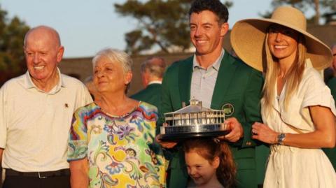 Rory McIlroy with his wife Erica Stoll, daughter Poppy, mother Rosie McDonald and father Gerry McIlroy