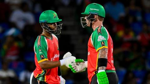 Ben McDermott and Shai Hope of Guyana Amazon Warriors punch gloves
