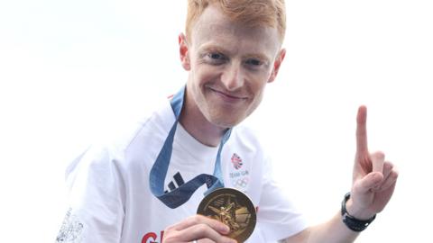 Harry Brightmore poses with his gold medal