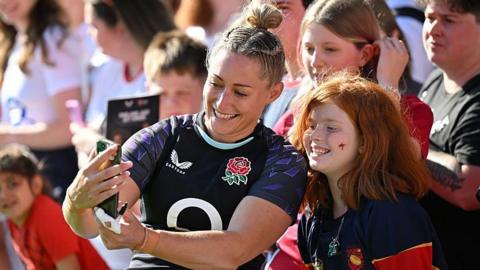 England's Natasha Hunt takes a selfie with a fan