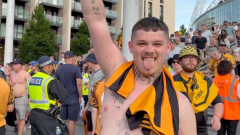 Hull City fan celebrates on Wembley Way