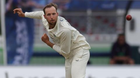 Tom Hartley bowling