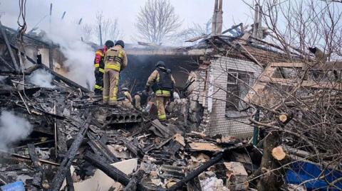 Ukrainian firefighters search through the rubble after Russian attacks on residential areas of the north-eastern Ukrainian city of Sumy. Photo: 17 February 2026