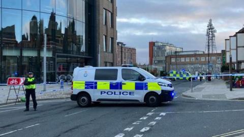 Police tape and vehicles outside the Moxy hotel in the Peasholme Green area of York.